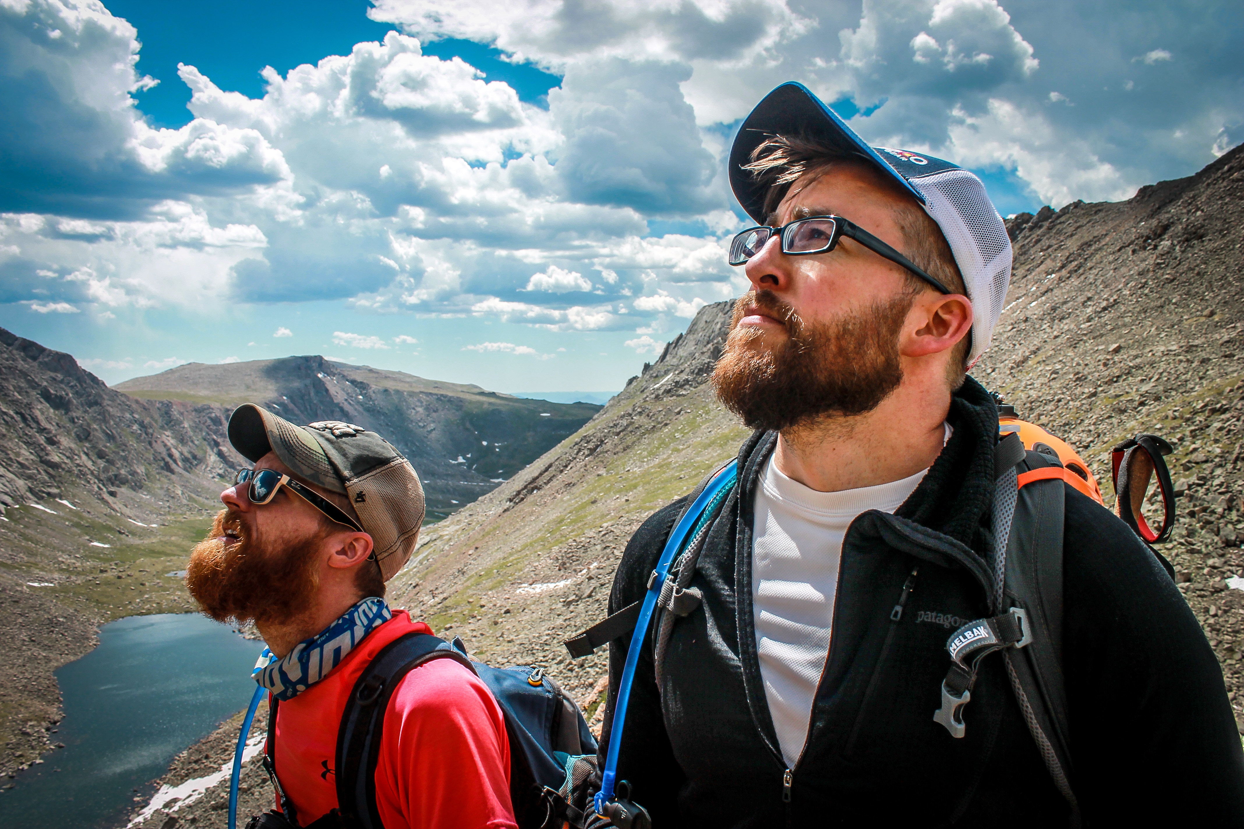 men climbing mountains together sharing bonding experience