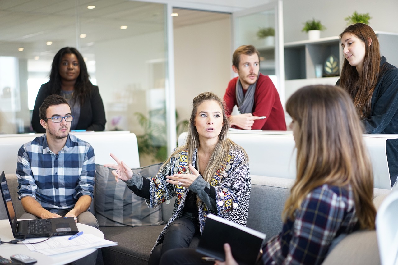 Leader and workers communicating goals for strategic plan