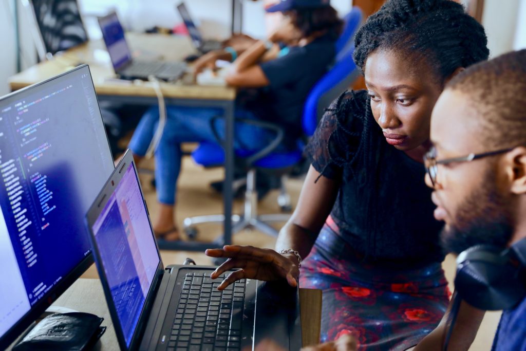 Woman boss helping team member