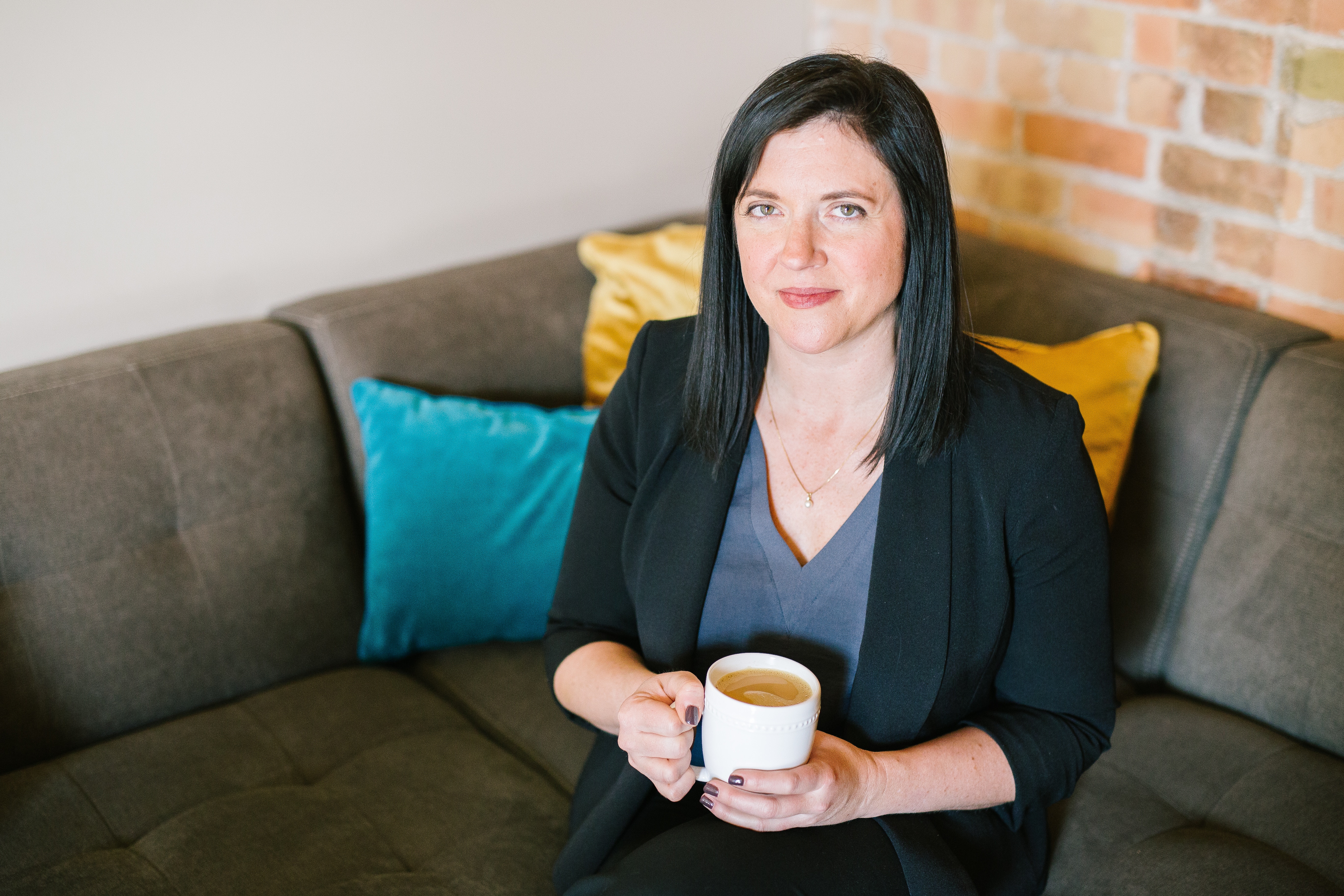 Business woman sipping coffee