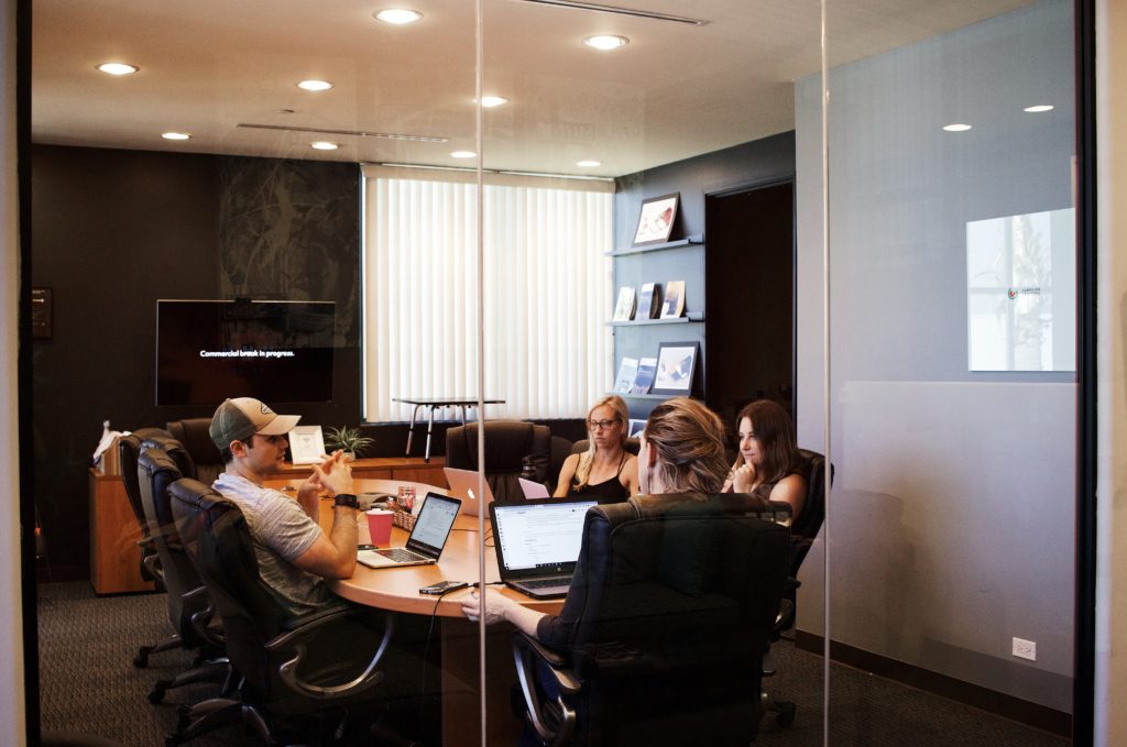 Group meeting in conference room talking about delegation of tasks