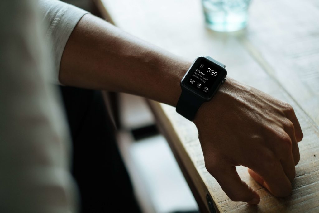 Man looking at Apple watch