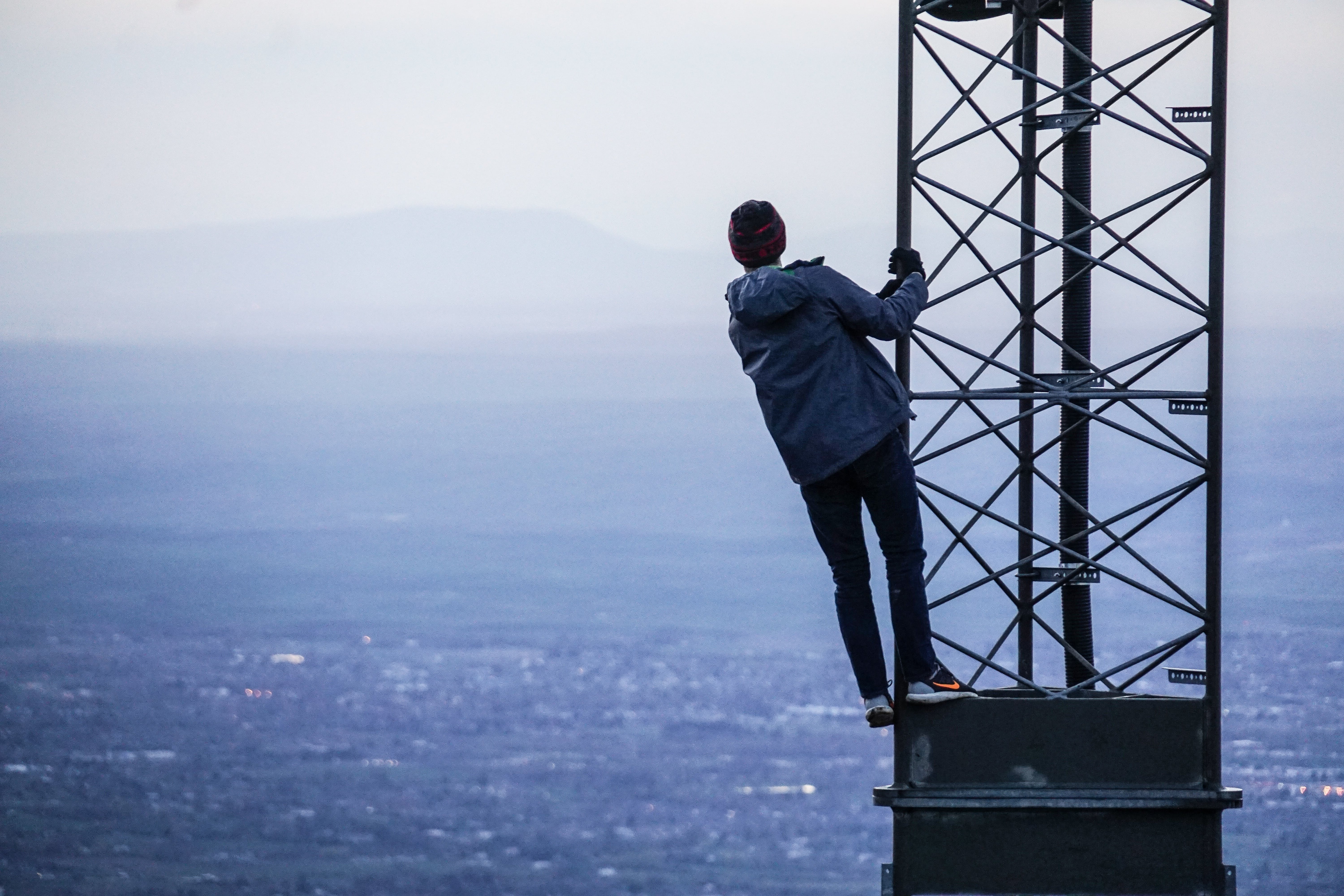 Man standing looking at mountains