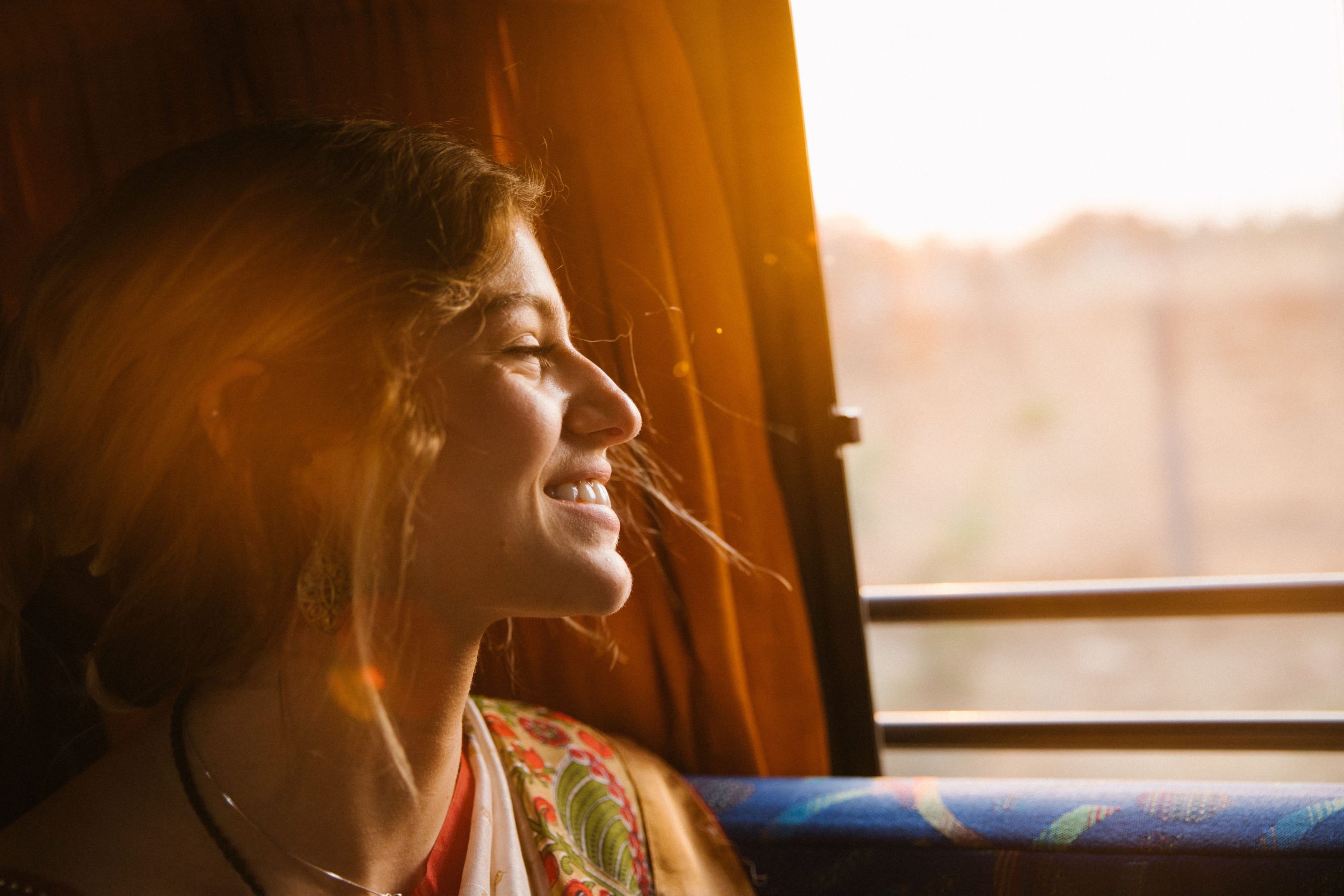 woman looking out the window to her future