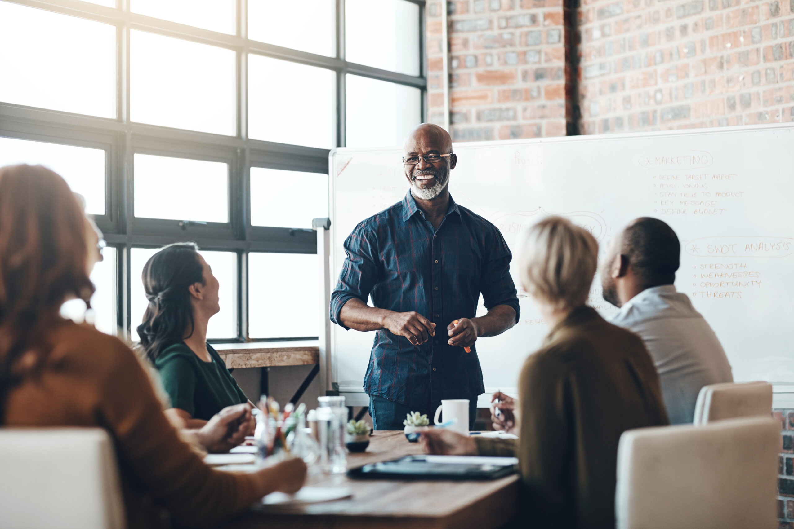 a leader in a meeting with people